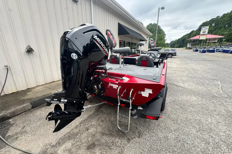 Slide: The Image of 2024 Bass Tracker RT178 boat with Mercury engine, parked outside a dealership. - 15