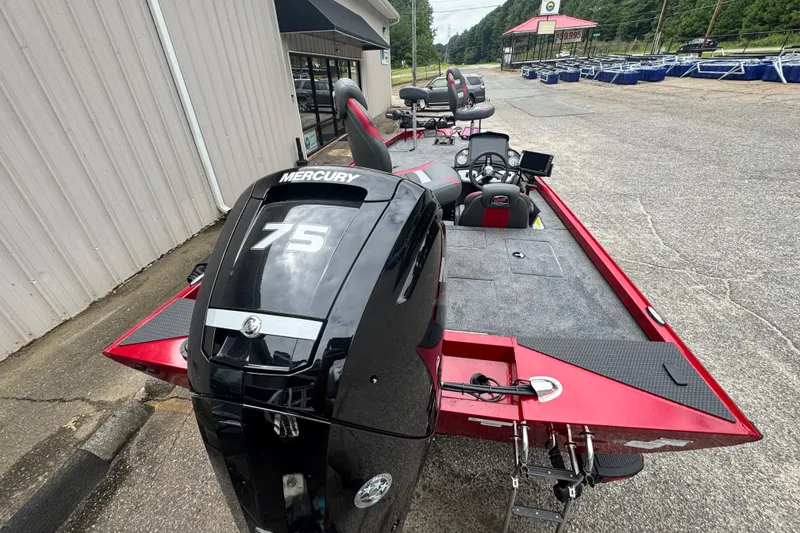 Slide: The Image of 2024 Bass Tracker RT178 boat with Mercury 75 engine, parked outdoors. - 16