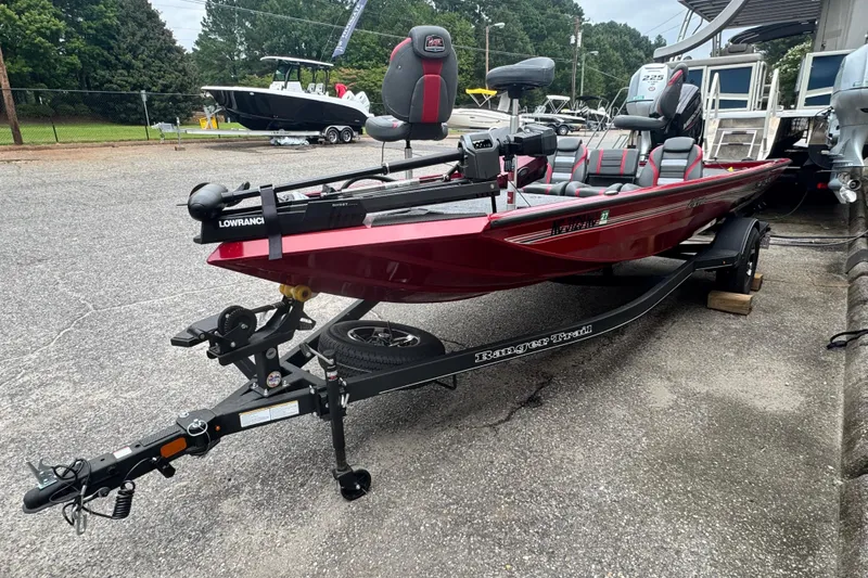 Slide: The Image of 2024 Bass Tracker RT178 fishing boat on trailer, featuring red exterior and Lowrance equipment. - 3