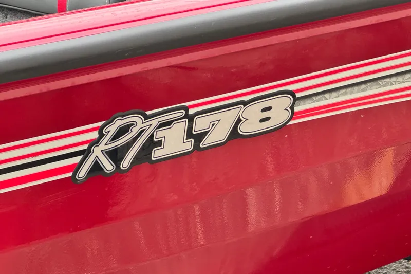 Slide: The Image of 2024 Bass Tracker RT178 boat with red and white detailing. - 6