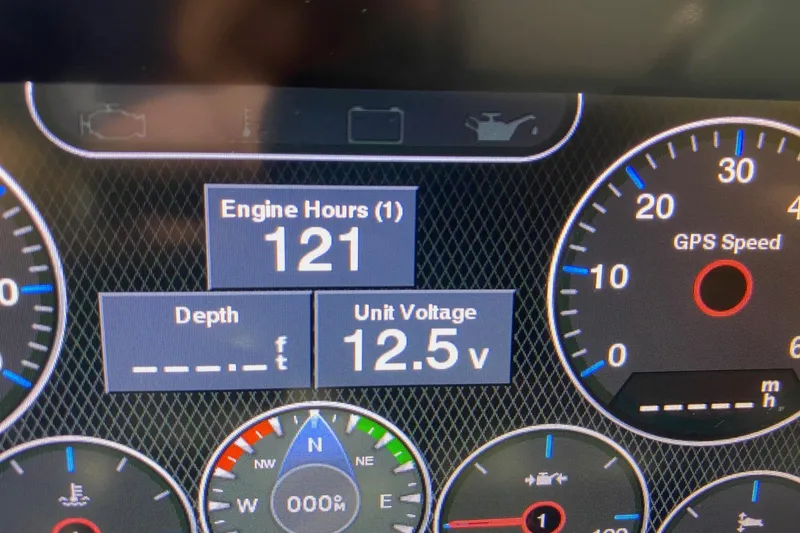 Slide: The Image of Dashboard display of a 2021 Cobalt R3 showing engine hours, depth, and unit voltage. - 11