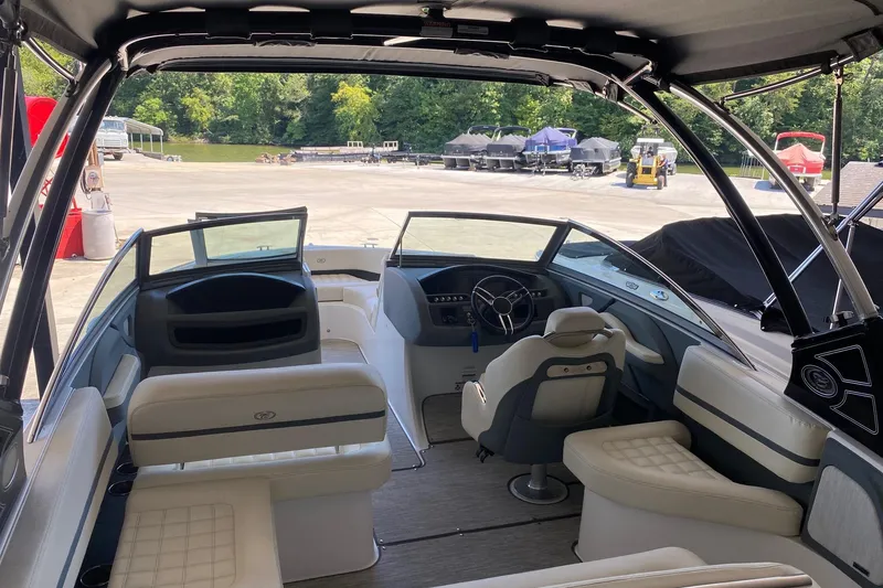 Slide: The Image of Interior of a 2021 Cobalt R3 boat with luxurious seating and modern dashboard. - 3