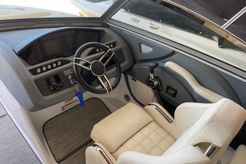 Slide: The Image of 2021 Cobalt R3 boat cockpit with steering wheel and control panel. - 4