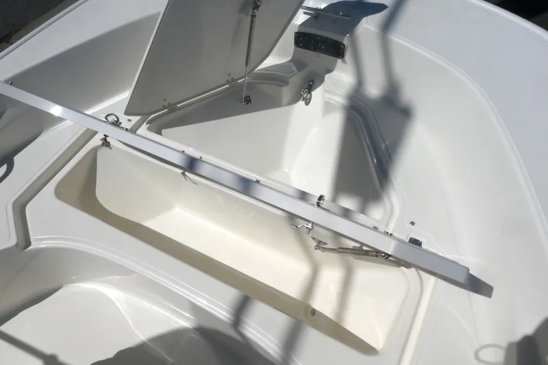 Slide: The Image of 2026 Boston Whaler 170 Montauk boat interior storage compartment open. - 11