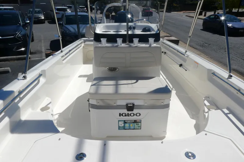 Slide: The Image of 2026 Boston Whaler 170 Montauk boat interior with Igloo cooler and seating. - 12
