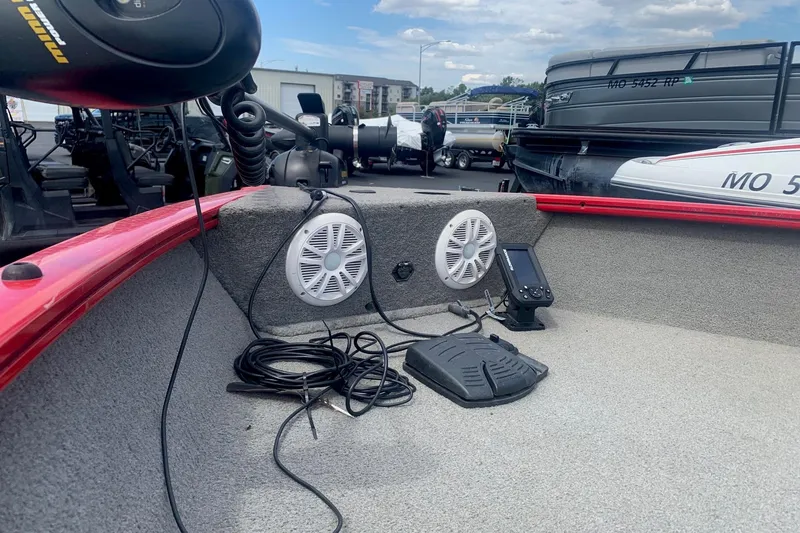 Slide: The Image of 2012 Tracker Pro Guide V-175 SC boat interior with speakers and navigation equipment. - 5