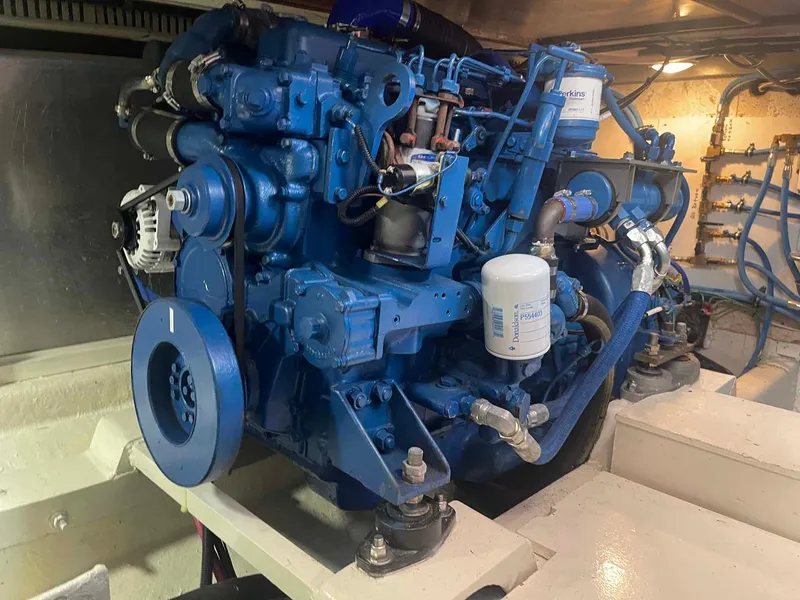 Slide: The Image of Engine room of 1985 DeFever 40 Offshore Cruiser with blue marine engine. - 30