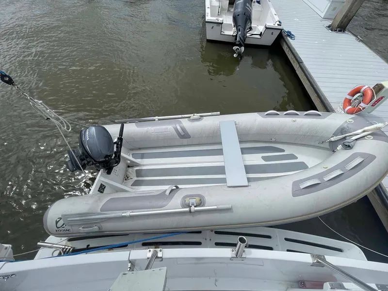 Slide: The Image of Inflatable dinghy attached to 1985 DeFever 40 Offshore Cruiser at dock. - 35