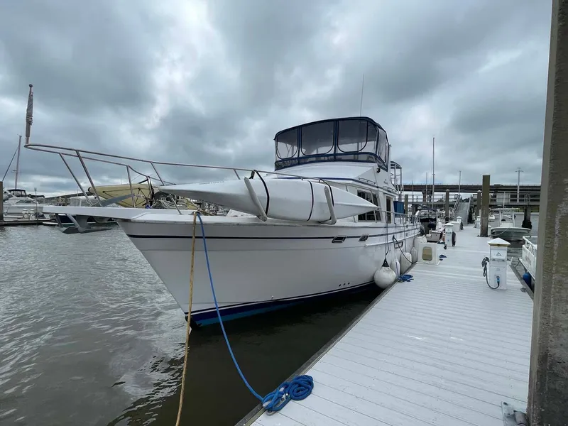 Slide: The Image of 1985 DeFever 40 Offshore Cruiser docked under cloudy skies. - 47