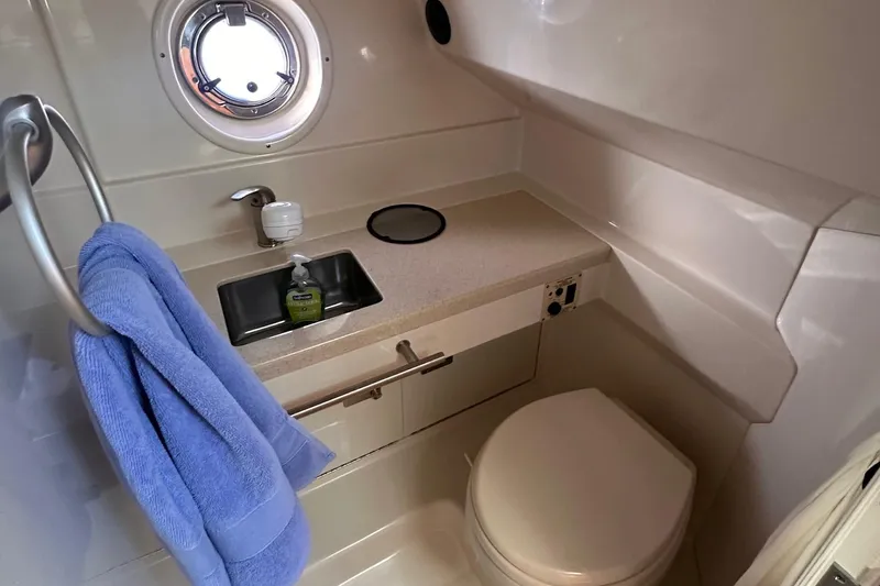 Slide: The Image of Bathroom interior of 2010 Sea Ray 310 Sundancer yacht with sink and toilet. - 13