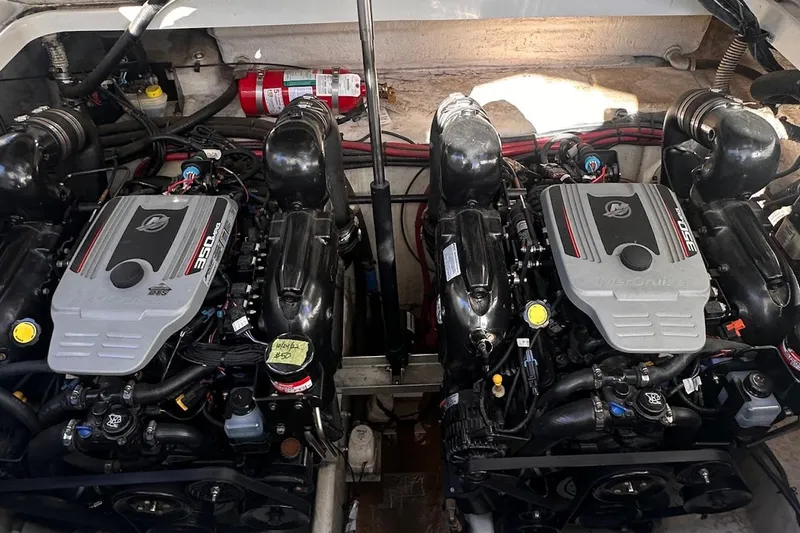 Slide: The Image of Engine compartment of a 2010 Sea Ray 310 Sundancer with dual MerCruiser engines. - 14