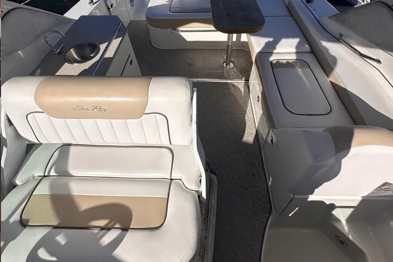 Slide: The Image of Interior of 2010 Sea Ray 310 Sundancer boat with seating and sink. - 5