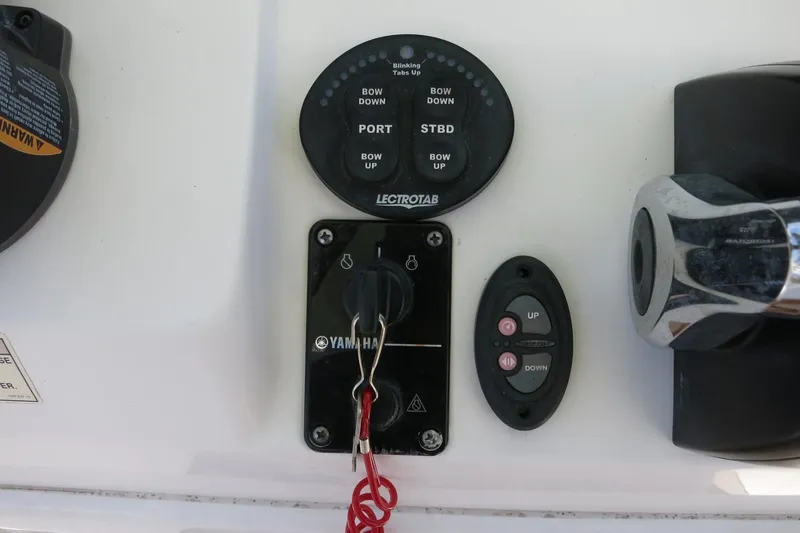 Slide: The Image of 2019 Sportsman Heritage 231 Center Console controls with Yamaha ignition and trim tabs. - 14