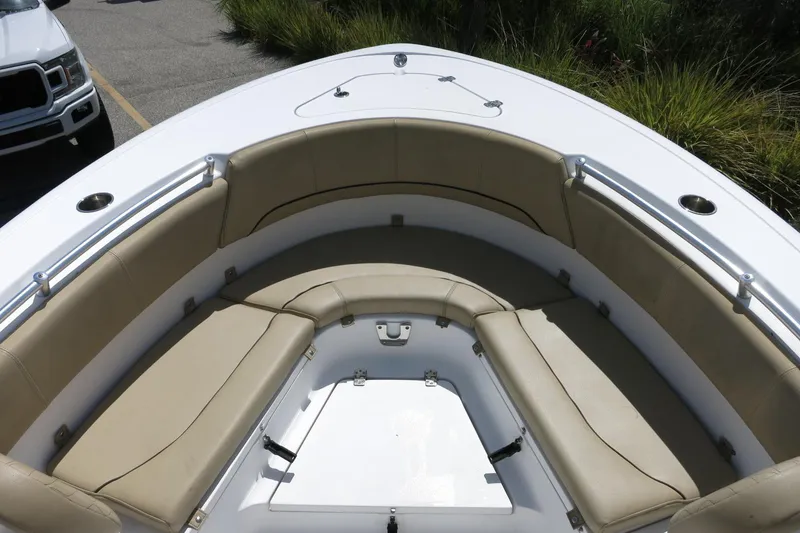 Slide: The Image of 2019 Sportsman Heritage 231 Center Console boat with cushioned seating area. - 15