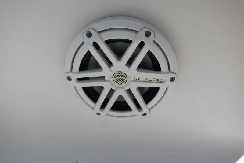 Slide: The Image of White JL Audio speaker on 2019 Sportsman Heritage 231 Center Console boat. - 23