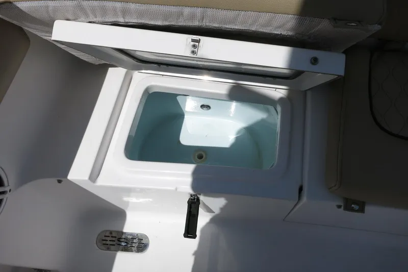 Slide: The Image of Livewell compartment on a 2019 Sportsman Heritage 231 Center Console boat. - 28