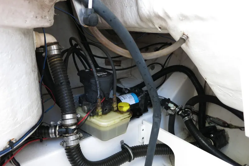 Slide: The Image of 2019 Sportsman Heritage 231 Center Console engine compartment with hoses and components. - 32