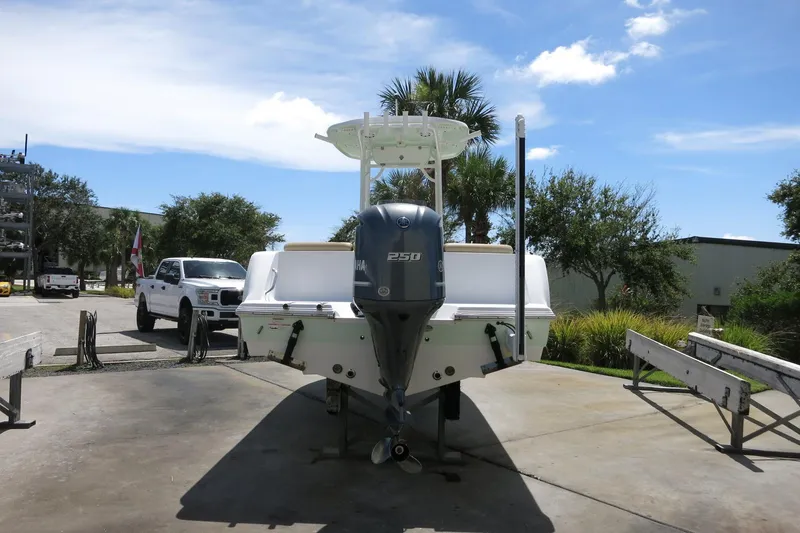 Slide: The Image of 2019 Sportsman Heritage 231 Center Console boat with Yamaha 250 engine, parked outdoors. - 6