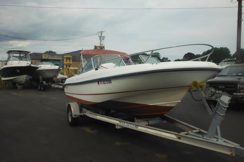 Slide: The Image of 2000 Boston Whaler 18 Ventura Bowrider on trailer in a boatyard. - 10