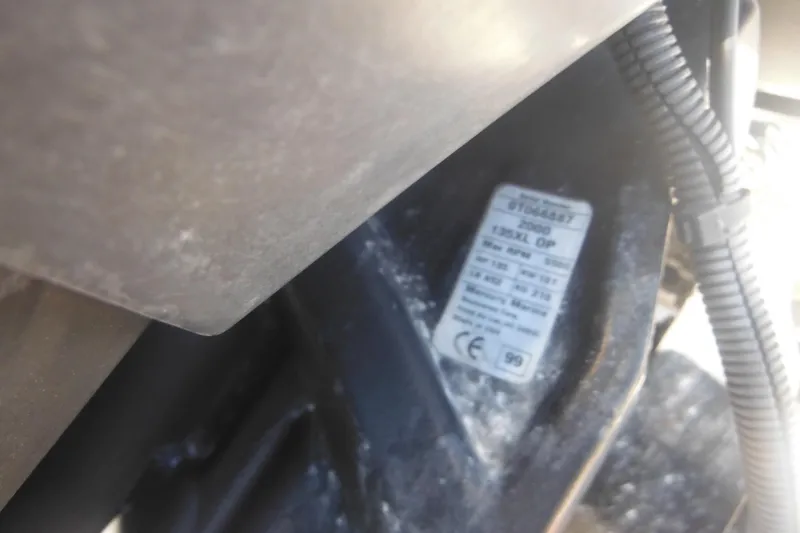 Slide: The Image of Close-up of a 2000 Boston Whaler 18 Ventura Bowrider engine label. - 11