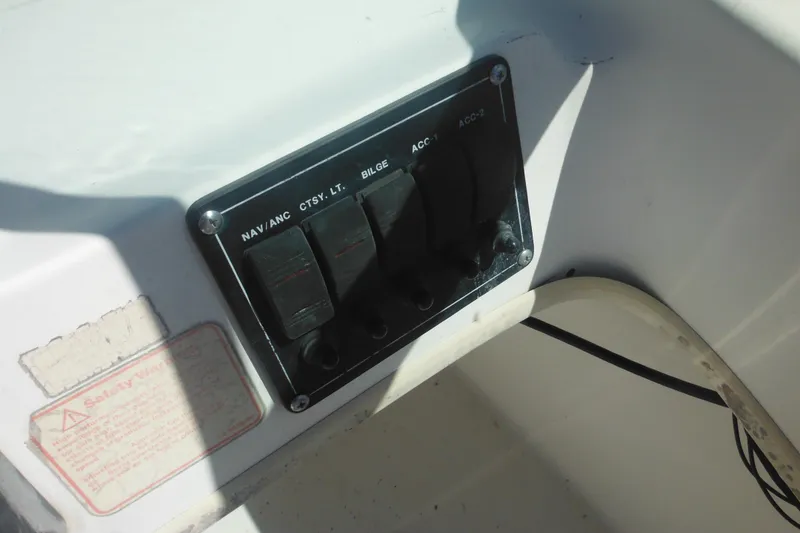 Slide: The Image of Control panel of a 2000 Boston Whaler 18 Ventura Bowrider boat. - 25