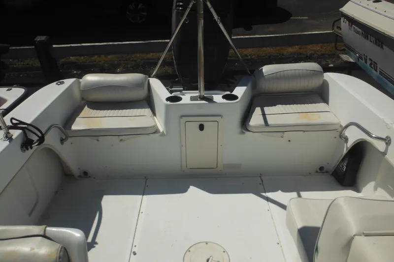 Slide: The Image of 2000 Boston Whaler 18 Ventura Bowrider interior with seating and storage compartments. - 29