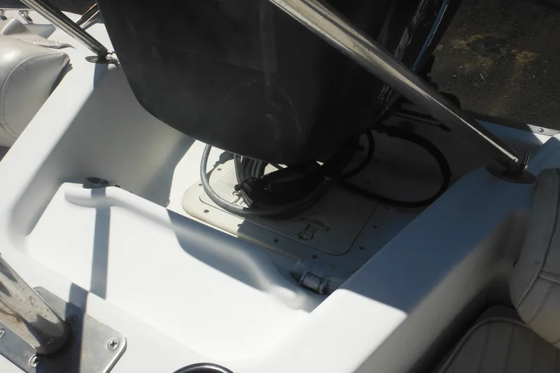 Slide: The Image of 2000 Boston Whaler 18 Ventura Bowrider interior with engine compartment detail. - 31