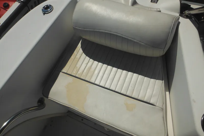 Slide: The Image of Worn seat of a 2000 Boston Whaler 18 Ventura Bowrider boat. - 34