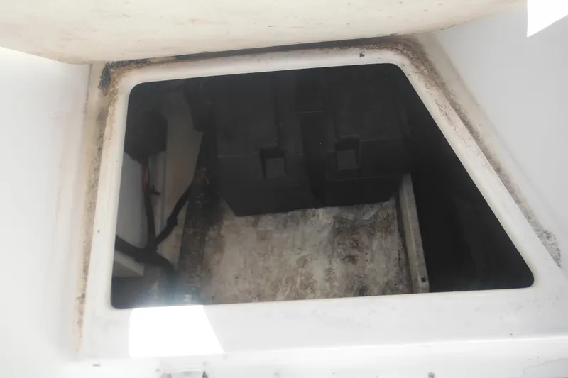 Slide: The Image of Battery compartment of 2000 Boston Whaler 18 Ventura Bowrider, showing interior details. - 35