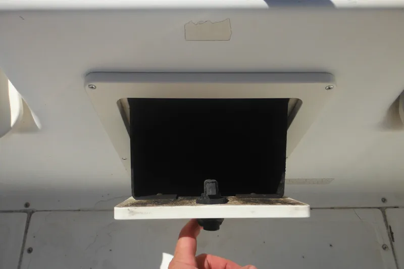 Slide: The Image of Open compartment on a 2000 Boston Whaler 18 Ventura Bowrider boat. - 37