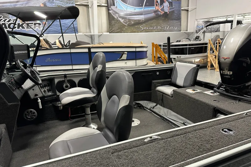 Slide: The Image of 2017 Alumacraft Trophy 185 boat interior with seating and Yamaha 150 engine. - 10