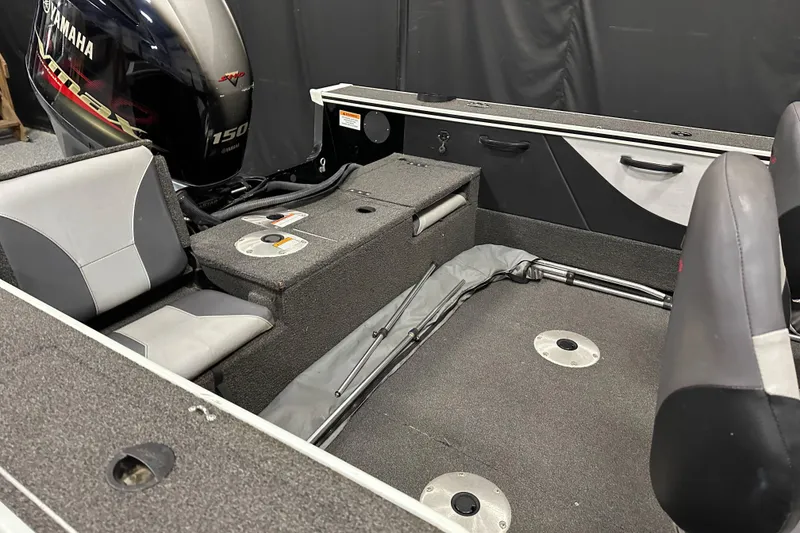 Slide: The Image of 2017 Alumacraft Trophy 185 boat interior with Yamaha 150 engine, featuring seating and storage. - 14