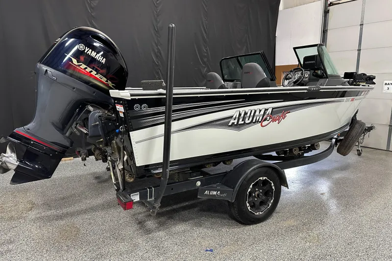 Slide: The Image of 2017 Alumacraft Trophy 185 boat with Yamaha outboard motor on trailer. - 2