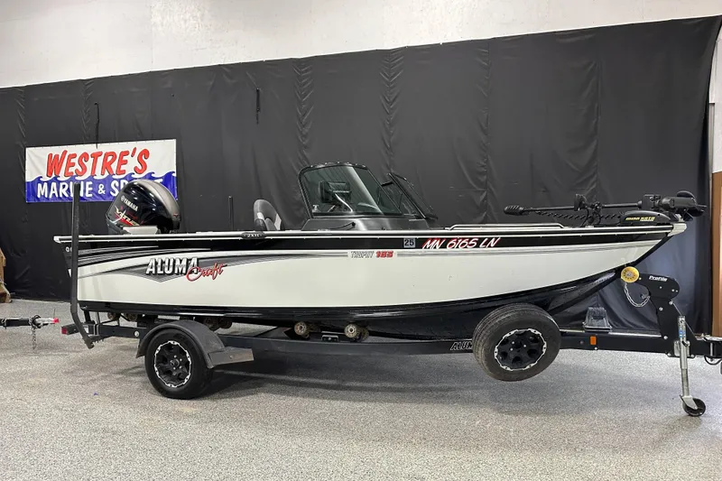 Slide: The Image of 2017 Alumacraft Trophy 185 boat on trailer at Westre's Marine & Sport showroom. - 4