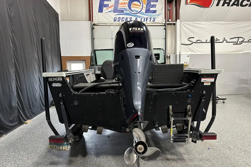 Slide: The Image of 2017 Alumacraft Trophy 185 boat with outboard motor in showroom. - 5