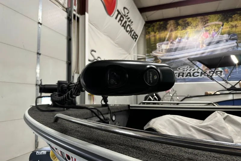 Slide: The Image of 2017 Alumacraft Trophy 185 boat with trolling motor in showroom. - 9