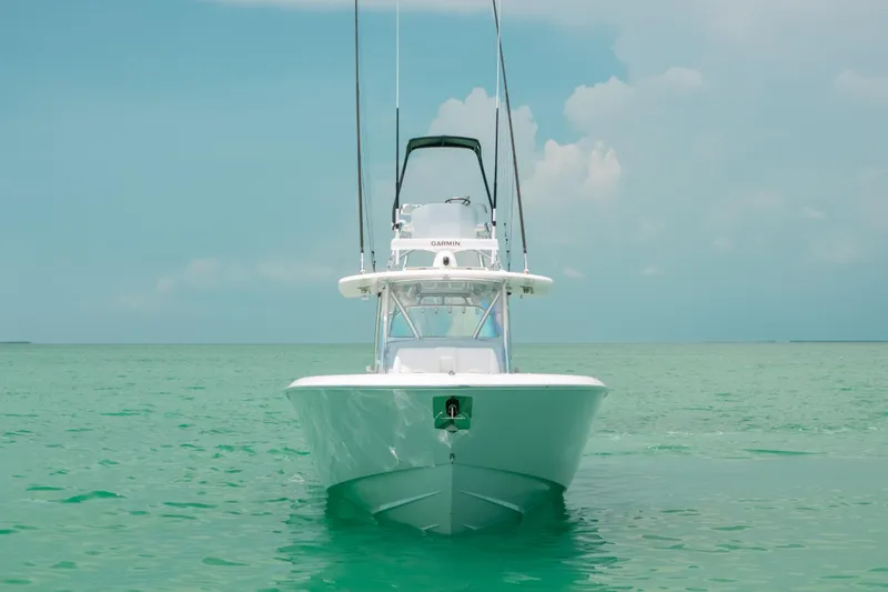 Slide: The Image of 2025 Contender 44 ST boat on turquoise water under clear sky. - 10