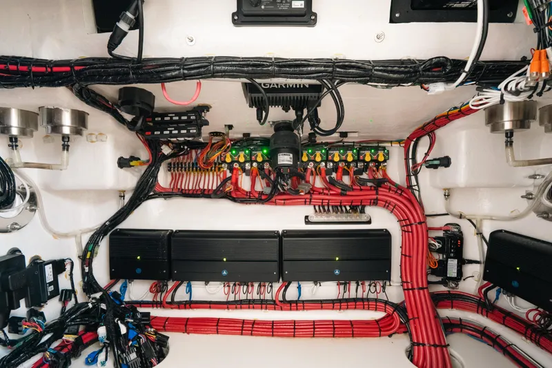Slide: The Image of Electrical system of 2025 Contender 44 ST boat with organized wiring and components. - 35