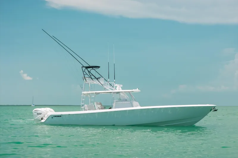 Slide: The Image of 2025 Contender 44 ST boat on turquoise water under clear sky. - 5