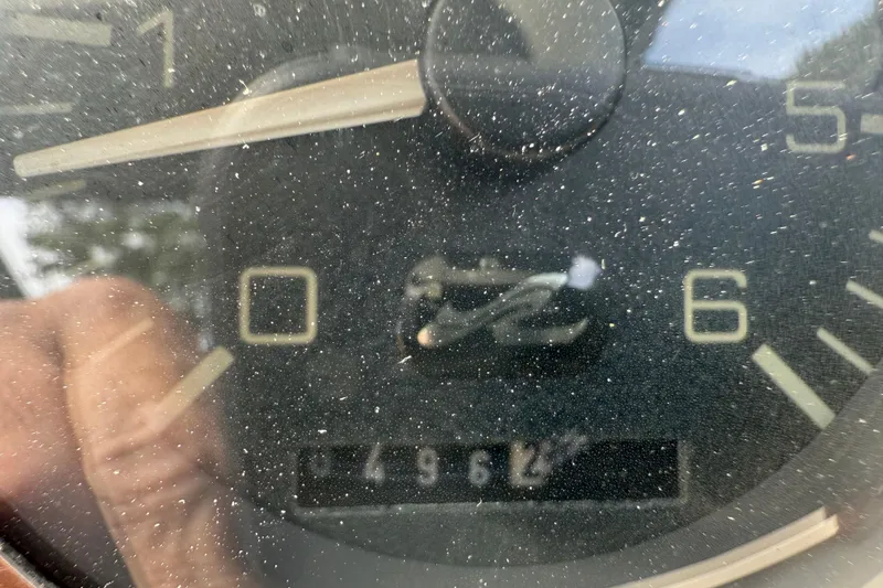Slide: The Image of Close-up of a dusty gauge on a 1998 Sea Ray 290 Sundancer boat. - 9
