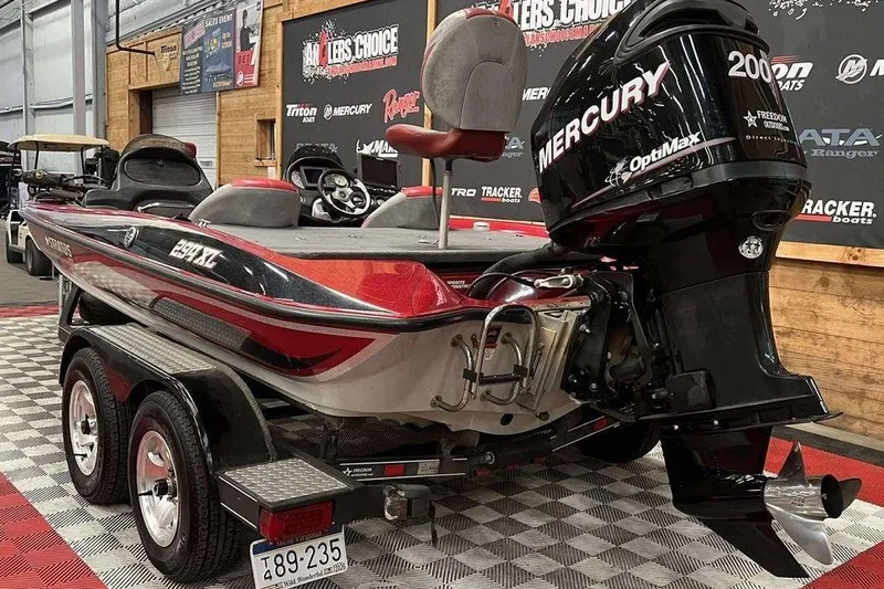 Slide: The Image of 2008 Stratos 294 XL boat with Mercury OptiMax engine in showroom. - 3