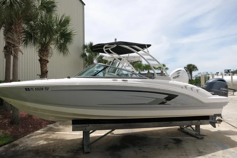The Image of 2023 Chaparral 23 SSi OB boat on display, featuring sleek design and modern outboard engine. - 0