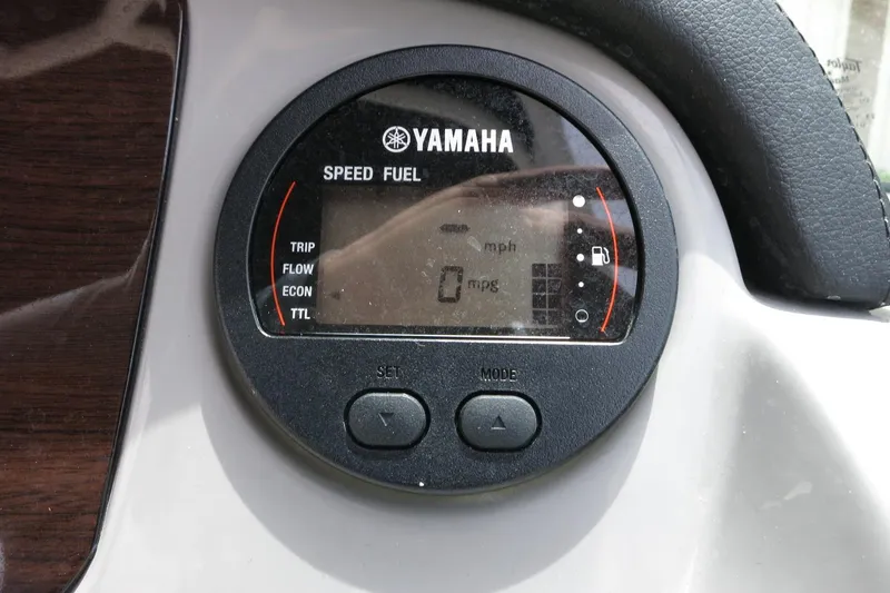 Slide: The Image of Yamaha speed and fuel gauge on 2023 Chaparral 23 SSi OB boat dashboard. - 23