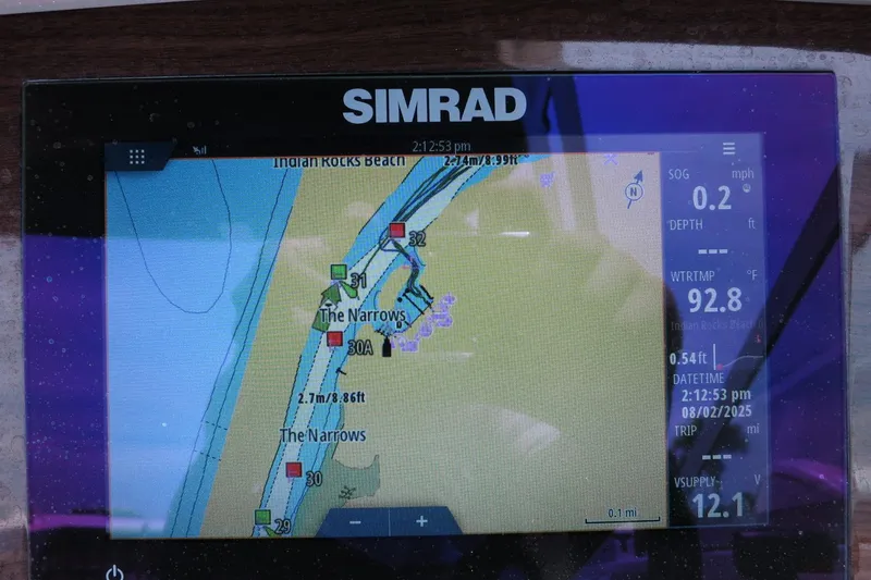 Slide: The Image of Simrad navigation display on 2023 Chaparral 23 SSi OB, showing map and data. - 26