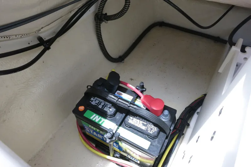 Slide: The Image of Battery compartment of 2023 Chaparral 23 SSi OB boat with wiring. - 34