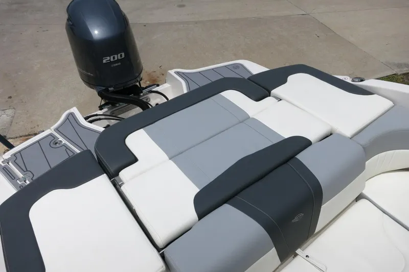Slide: The Image of 2023 Chaparral 23 SSi OB boat with Yamaha 200 engine, featuring sleek seating design. - 37