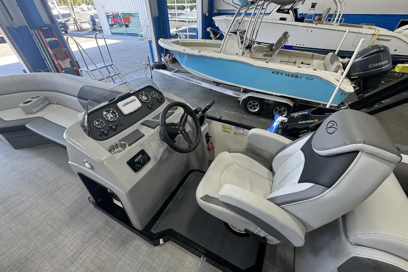 Slide: The Image of 2025 Veranda Vista Sport VS 22 RC boat interior with steering console and seating. - 5