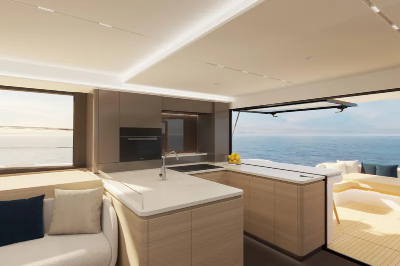 Slide: The Image of Modern Veya 53 yacht interior, 2026 model, featuring sleek kitchen and ocean view. - 25