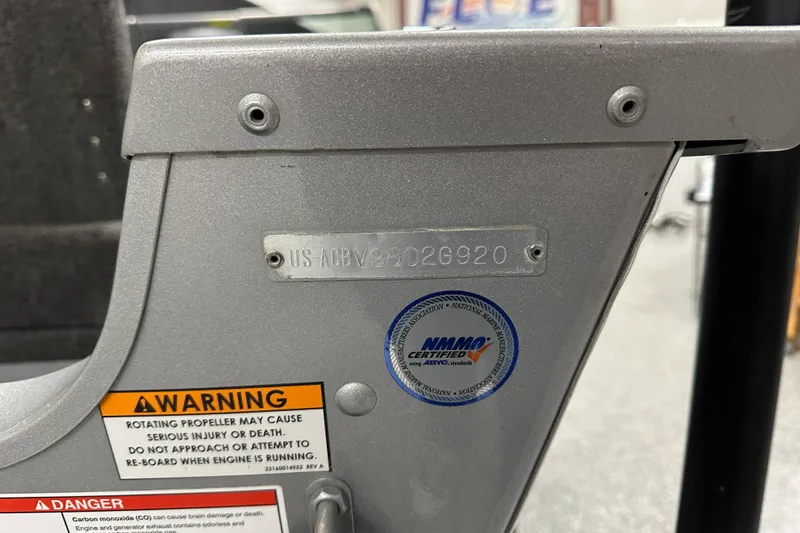 Slide: The Image of 2020 Alumacraft Classic 165 Sport boat with warning labels and NMMA certification sticker. - 16