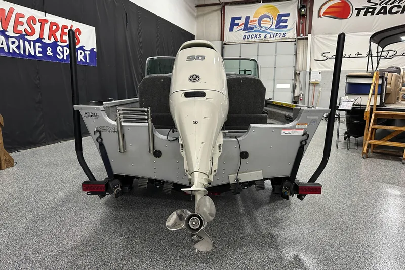 Slide: The Image of 2020 Alumacraft Classic 165 Sport boat with outboard motor in showroom. - 5